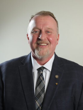 Board of Director Chris Murray in a suit and tie