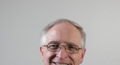 Headshot of Fr. Davis priest in his clerics
